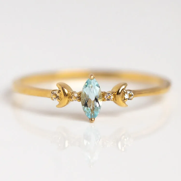 Solid Gold Blue Topaz Crescent Moon Ring for Clarity