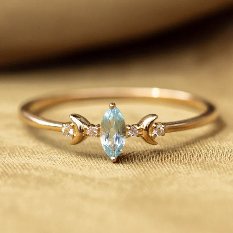 Solid Gold Blue Topaz Crescent Moon Ring for Clarity